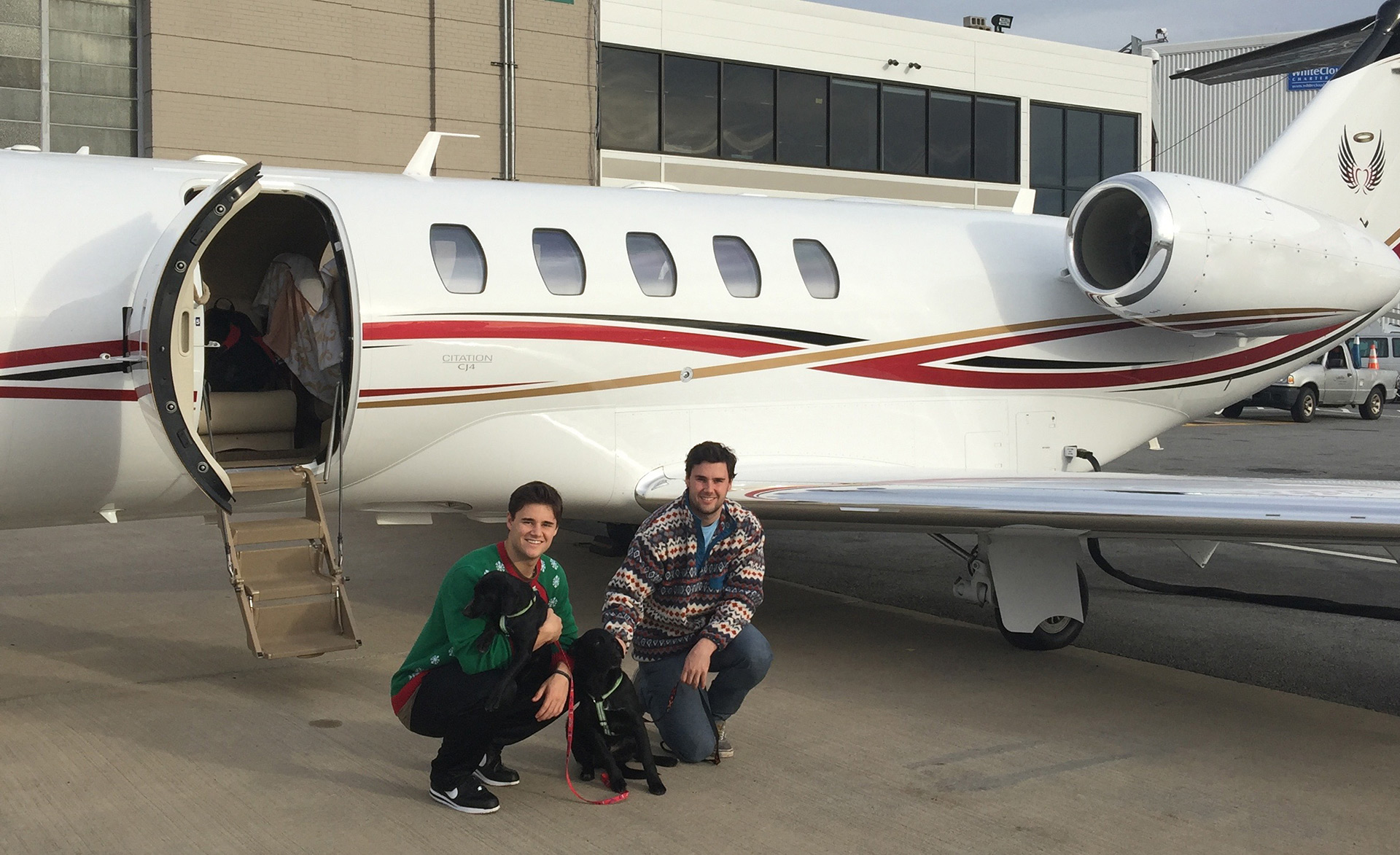 Pilots with pets in front of Cessna Citation